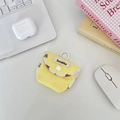 Close-up of a yellow contrast color fabric earphone pouch on a clean desk setup - Grid Yellow