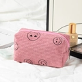 Pink corduroy makeup bag featuring black embroidered smiley faces and silver zipper - Pink Heart-Eye Medium Makeup Bag