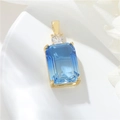 Detailed close-up of a blue rectangle gemstone pendant with gold-plated setting and zircon - H-11036 Rectangle Gemstone