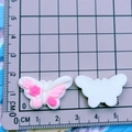 Detailed scale view of colorful 3D resin butterfly charms for DIY shoe decoration - White