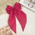 Rose red oversized satin bow hair clip with long ribbons on a stylish aesthetic background - Rose Red