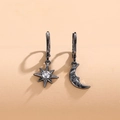 Asymmetric gunmetal star and moon hoop earrings with crystal inlay and carved facial details - Black with White Zirconia