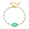 Primer plano detallado de pulsera de estrella en acero dorado y colgante esmaltado - Azul Claro (XN138-lightblue)