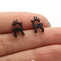 Detailed view of small black reindeer stud earrings held to show compact product size - Black Running Deer (665)