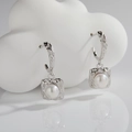 Detailed shot of s925 silver pearl drop earrings with hand-hammered texture frame - Natural Pearl Silver Earrings (Silver)