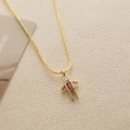 Detailed macro view of a gold robot pendant necklace with a red rectangular gemstone - July Rose Red