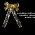 Lichtgevende gouden kerststrik met LED-verlichting en sterpatronen decoratie - Goud Bedrukte Strik + Warm Licht