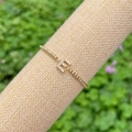 18K gold plated bead bracelet featuring a sparkling micro-paved letter E charm pendant - Gold E