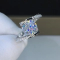Macro shot of silver twisted band ring with large round solitaire and side accents - 2-carat Eight-heart Eight-arrow Ljz-217 / Adjustable Open