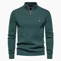 Detail of dark green knit sweater featuring vertical ribbed texture and a half-zip stand collar - Green