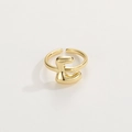 Detailed view of adjustable 18K gold plated ring featuring a 3D letter E design - Gold Ring E