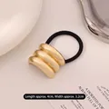 Three-layer wavy gold metal hair tie with high elastic black band for women - Kc Gold Triple Layer