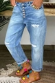 Dettaglio dei jeans azzurri con chiusura a bottoni e strappo sul ginocchio - L / Azzurro