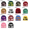 Grid display of 14 different colors of THE RISK jacquard knit beanies with dice pattern - Capybara 202