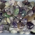 Polished natural heart-shaped rose quartz and fluorite stones in various colors - Fluorite