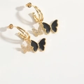 Detail view of gold butterfly earrings with black enamel and sparkling white zircon pavé - Black