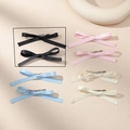 Dettaglio di fermagli per capelli con fiocco a doppio strato in quattro colori pastello - Fermagli per Capelli con Fiocco (Paio) / Nero