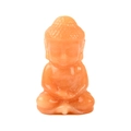 Handcrafted orange natural crystal Buddha figurine with a smooth polished finish - Red Aventurine