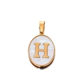 Macro detail of oval gold pendant with white shell inlay and gold letter H charm - Gold Letter H