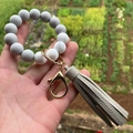 Detail of marble pattern silicone beads and gray tassel on a gold metal keychain ring - Style 9-Grey Marble White/Grey Tassel