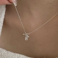 Macro detail of S925 silver necklace featuring a toggle clasp and clear crystal pendant - Silver