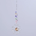 Macro shot of colorful faceted crystal beads and flower pendant on silver chain - Clear