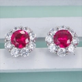 Classic silver halo stud earrings featuring central red gemstone and clear accents - Stud Earrings