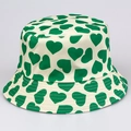 Off-white bucket hat featuring green heart patterns for sun protection and style - M (56-58cm) / Green and White