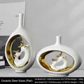 Set of two modern white ceramic vases with golden reindeer sculptures for wine cabinet decor - Eternal Companionship Elk Vase White Gold Set (2 Pieces)