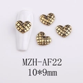 Detail von Vintage-Gold-Herz-Nagelcharms mit Rautenmuster auf weißer Basis - AF22-Gold Großes Gestepptes Herz