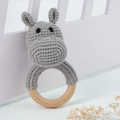 Detailed view of handmade grey crochet hippo baby rattle with natural wooden ring - Hippo