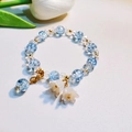 Light blue and clear beaded bracelet with golden butterfly clasp and lily of the valley charm - S017-blue Lily Of The Valley Bracelet #sz183