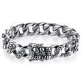 Close-up of silver punk skull bracelet with a large sturdy clasp on white background - Skull Seventeen / Silver