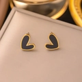 Luxurious gold-plated heart earrings with black inlay on a premium leather display - Heart Black and White Stud Earrings (QYG45) / Gold