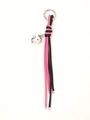 Detail of pink and black woven leather keychain with a silver heart pendant on white background - Pink & Black