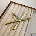 Golden geometric bow hair clip in minimalist metal style on velvet display box - Gold Metal Bow Clip