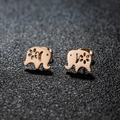 Polished rose gold elephant stud earrings with hollow flower detail on grey background - 278 Rose Gold (Elephant)