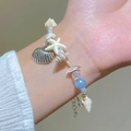 Bracciale bohémien multistrato stile oceano con ciondolo a stella marina e perline blu - Conchiglia Blu Cielo Argento Antico (30 Argento Antico Blu Cielo 3189)