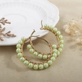 Detail of gold hoop earrings with handmade mint green mother-of-pearl bead wrapping - Light Green