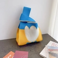 Blue and yellow knit tote bag featuring a white tulip pattern and single handle design - Blue Tulip