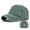 Detail view of the vintage washed green baseball cap with elastic criss-cross ponytail hole - Washed Distressed Ponytail Hole / Army Green