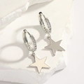 925 silver star tassel earrings with paved diamonds on a white stone background - Smooth Star Hoop