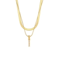 Close-up of double layer gold snake chain necklace with elegant vertical pearl pendant - Letter I