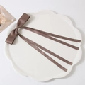 Elegant large brown satin ribbon bow hair clip with long streamers on a white plate - Ribbon Duckbill Clip / Light Coffee