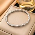 Polished silver bamboo-style titanium steel open bangle displayed in a luxury jewelry box - 【z4817】bamboo Joint Bangle Steel Color