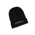 Detailed view of white '00's baby girl' embroidery on a black ribbed knit beanie hat - M (56-58cm) / Black