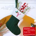 Green knit Christmas stocking with letter Y embroidery and festive berry decor - Letter Y / Dark Green