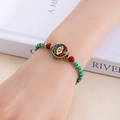Détail d'un bracelet bohème vintage avec perles turquoise et pendentif nuage gravé - Avenir Radieux