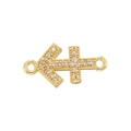 Macro shot of gold Sagittarius zodiac pendant with cubic zirconia and dual connectors - Gold Sagittarius