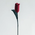 Handmade crochet red tulip flower bouquet with green leaves and knitted texture - Closed Red Tulip